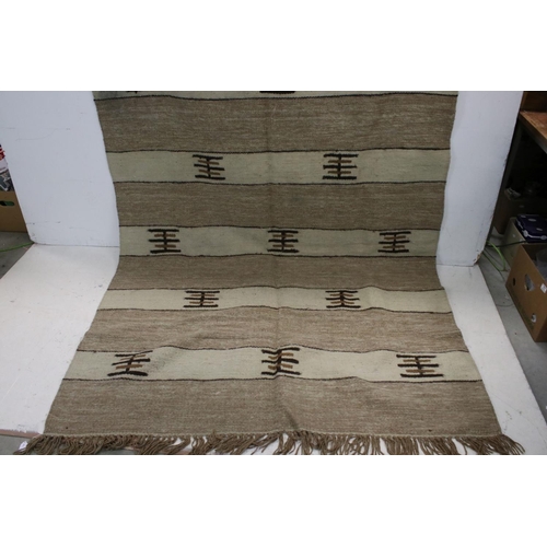 841 - Two Beige and Cream Wool Rugs with stylised pattern, 225cms x 163cms and 147cms x 65cms