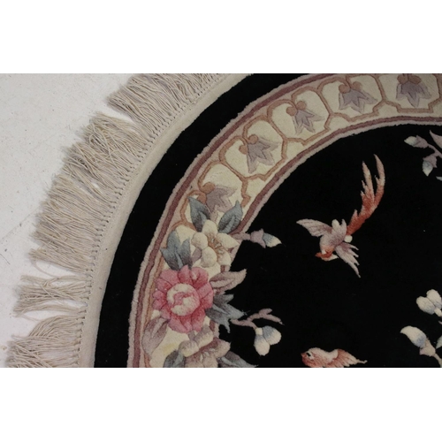 843 - Chinese Hand Knotted Wool Circular Rug, black and cream ground with  pattern of birds and flowers, 1... 