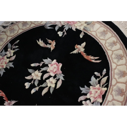 843 - Chinese Hand Knotted Wool Circular Rug, black and cream ground with  pattern of birds and flowers, 1... 