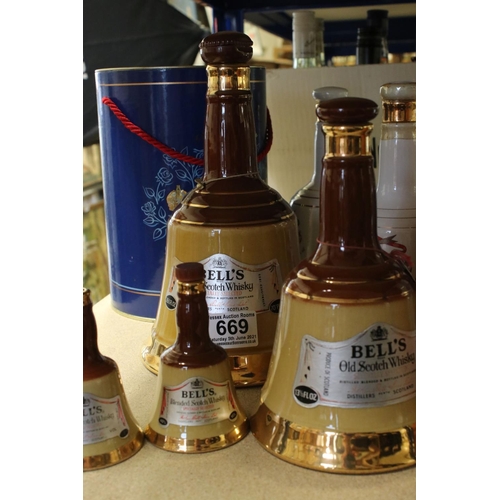 669 - A collection of Bell's Scotch whisky ceramic decanter bottles to include Royal examples.