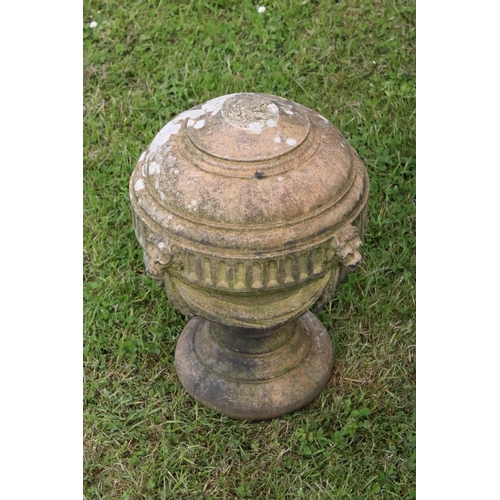 691 - A group of five stone urn shaped lion wall finials. measuring approx 46cm in height. (understood to ... 