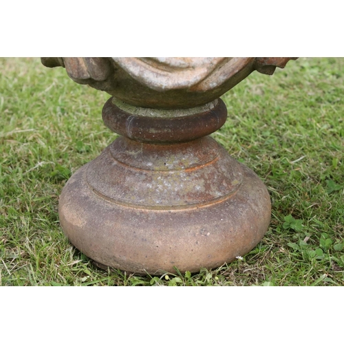 691 - A group of five stone urn shaped lion wall finials. measuring approx 46cm in height. (understood to ... 