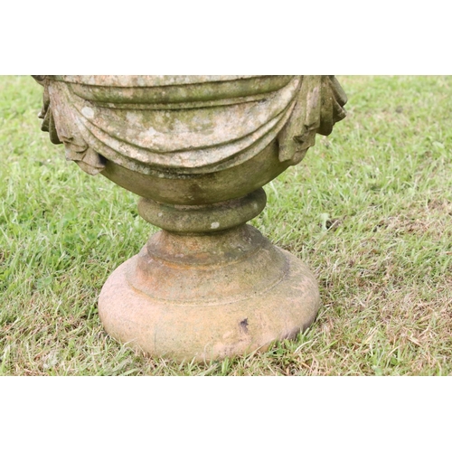 691 - A group of five stone urn shaped lion wall finials. measuring approx 46cm in height. (understood to ... 