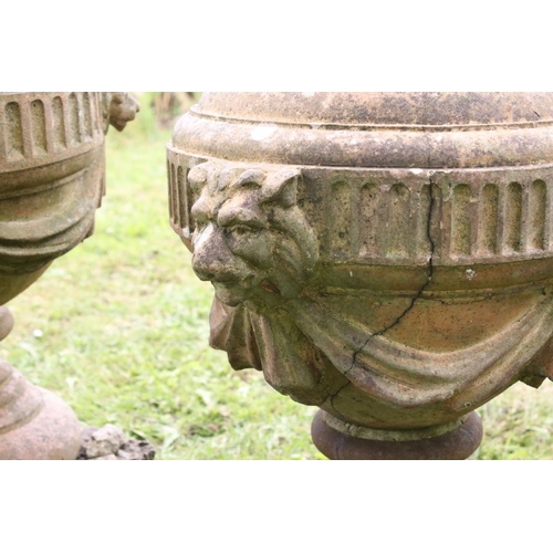 691 - A group of five stone urn shaped lion wall finials. measuring approx 46cm in height. (understood to ... 