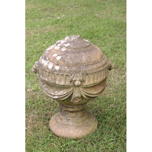 691 - A group of five stone urn shaped lion wall finials. measuring approx 46cm in height. (understood to ... 