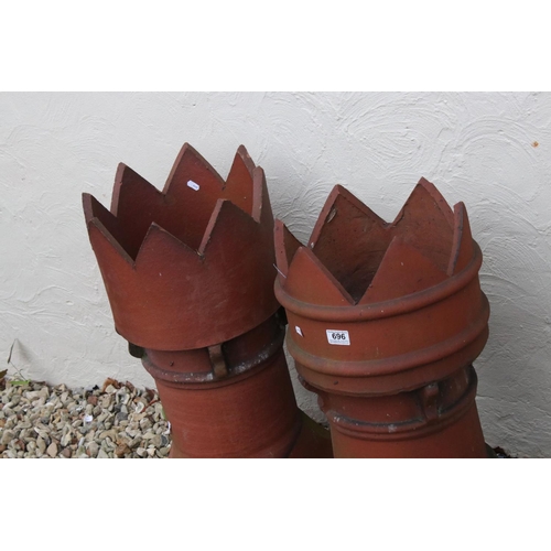 696 - Two large terracotta chimneys, stands approx 70cm in height.