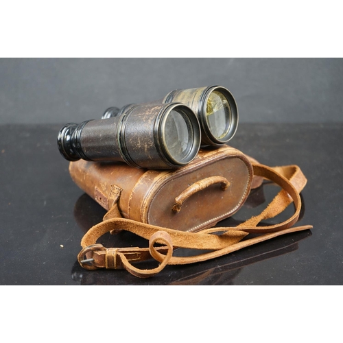 616 - Three pairs of binoculars to include a pair of WW2 era German examples together with a brass cased w... 