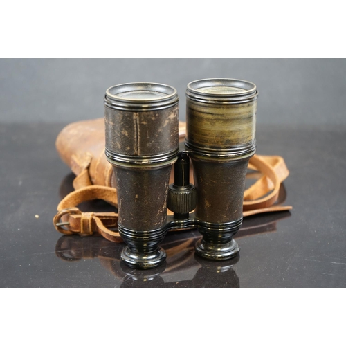 616 - Three pairs of binoculars to include a pair of WW2 era German examples together with a brass cased w... 