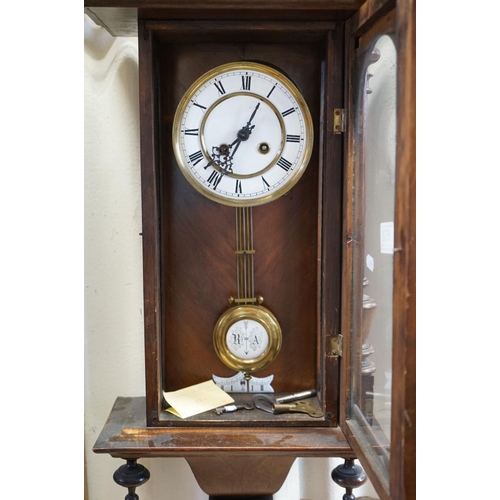 658 - A mahogany cased Vienna style wall clock with two train movement.