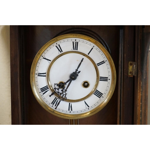 658 - A mahogany cased Vienna style wall clock with two train movement.