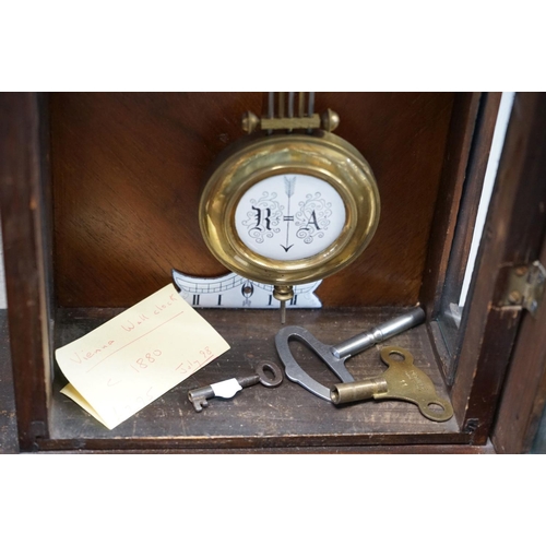 658 - A mahogany cased Vienna style wall clock with two train movement.