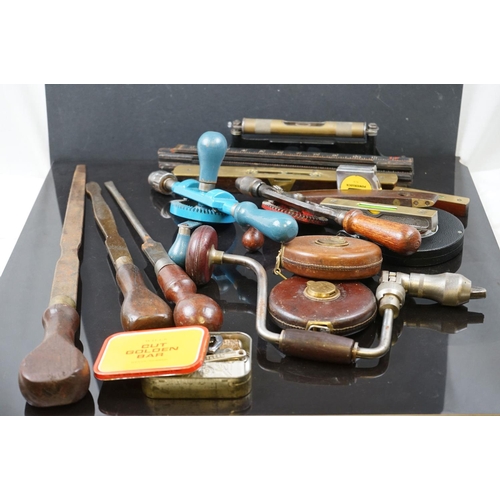 667 - A collection of vintage tools to include Drills, Chisels, Tapes and levels.