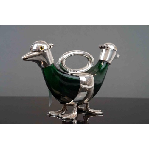 339 - Emerald coloured glass claret jug with two silver plated duck heads