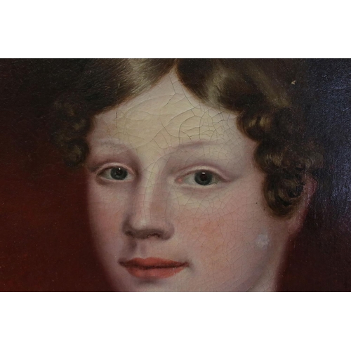 66A - A large early 19th century oil on canvas painting mounted in an ornate gilt portrait of a young wome... 