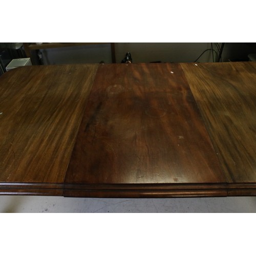 719 - Large Victorian Mahogany Wind-out Dining Table with one additional leaf and raised on carved turned ... 