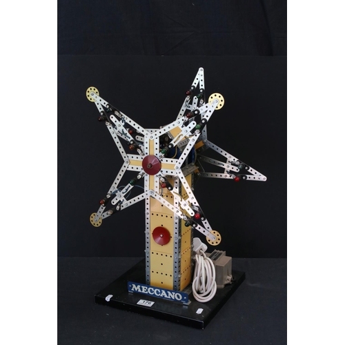 176 - Meccano mechanical windmill, with star to each side, on wooden stand, with lights, untested, on a wo... 