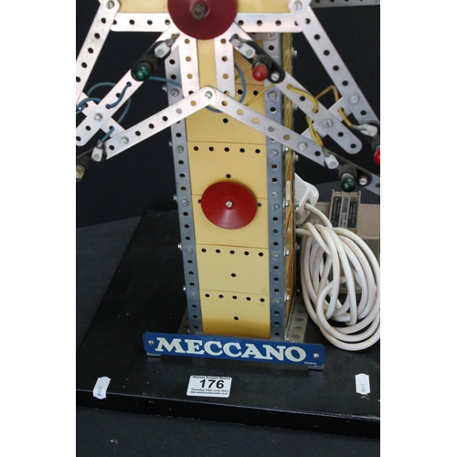 176 - Meccano mechanical windmill, with star to each side, on wooden stand, with lights, untested, on a wo... 