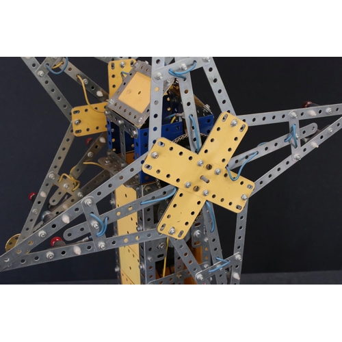 176 - Meccano mechanical windmill, with star to each side, on wooden stand, with lights, untested, on a wo... 