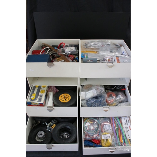 201 - Two cabinets with three drawers each, containing a quantity of various construction accessories from... 