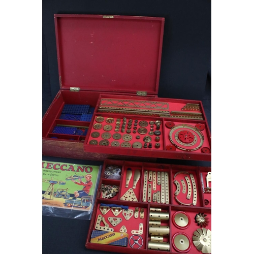 181 - Stained red mid 20th century Meccano box, with three trays, various parts and instructions for outfi... 