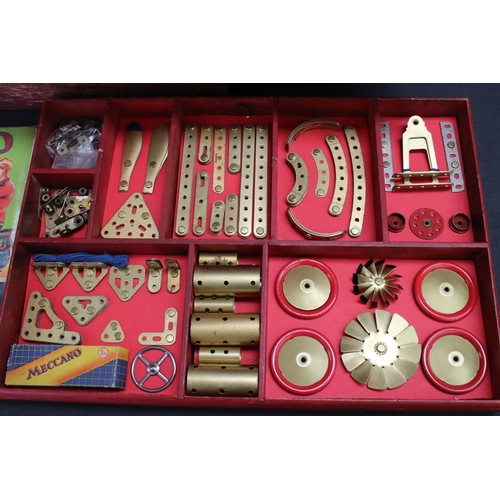 181 - Stained red mid 20th century Meccano box, with three trays, various parts and instructions for outfi... 