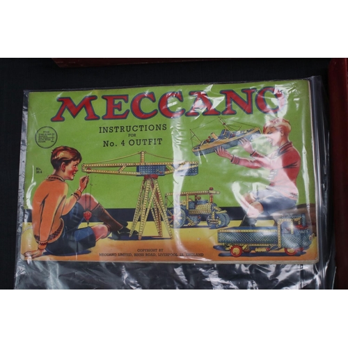 181 - Stained red mid 20th century Meccano box, with three trays, various parts and instructions for outfi... 