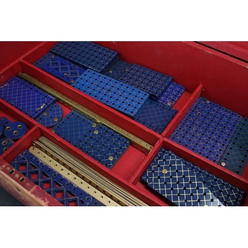 181 - Stained red mid 20th century Meccano box, with three trays, various parts and instructions for outfi... 