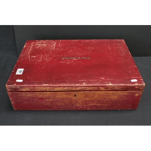 181 - Stained red mid 20th century Meccano box, with three trays, various parts and instructions for outfi... 