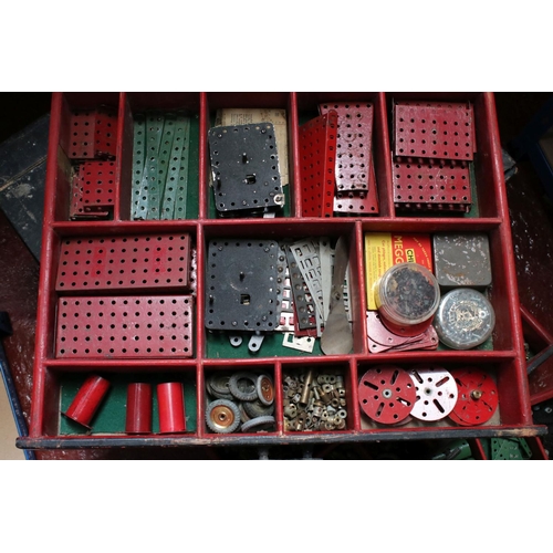 183 - Large four door cabinet containing various Meccano accessories, several colours, showing some wear