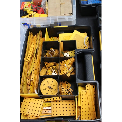 185 - Four plastic containers of various Meccano items and accessories to include a container of blue & ye... 