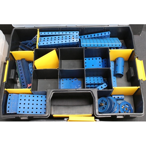 185 - Four plastic containers of various Meccano items and accessories to include a container of blue & ye... 