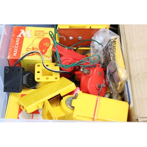 185 - Four plastic containers of various Meccano items and accessories to include a container of blue & ye... 