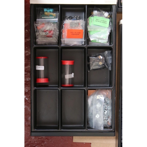 204 - Bisley ten drawer cabinet containing various Meccano accessories, items and pieces, several colours,... 