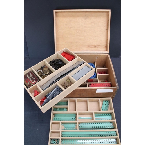 220 - Quantity of Marklin construction accessories and parts, various colours, within wooden box that has ... 