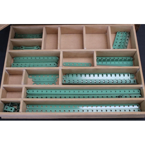 220 - Quantity of Marklin construction accessories and parts, various colours, within wooden box that has ... 