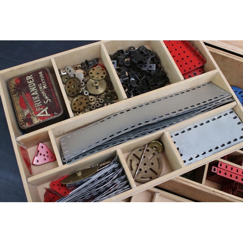 220 - Quantity of Marklin construction accessories and parts, various colours, within wooden box that has ... 