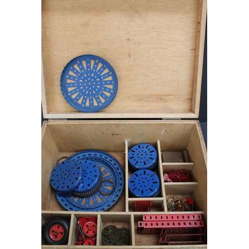 220 - Quantity of Marklin construction accessories and parts, various colours, within wooden box that has ... 