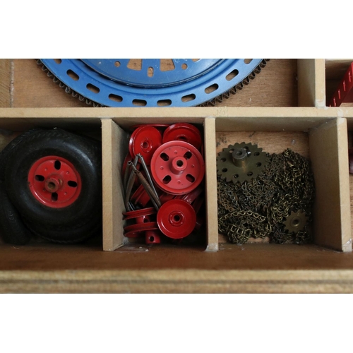 220 - Quantity of Marklin construction accessories and parts, various colours, within wooden box that has ... 