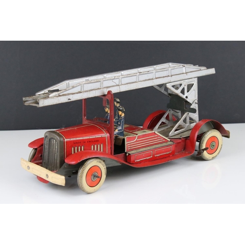 272 - Mettoy tin plate clockwork fire engine model with 3 x fireman figures, tyres marked Dunlop Fort, som... 