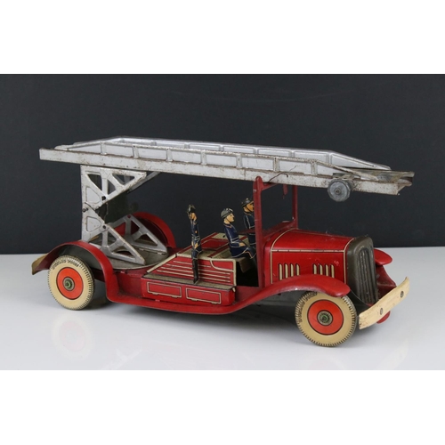 272 - Mettoy tin plate clockwork fire engine model with 3 x fireman figures, tyres marked Dunlop Fort, som... 