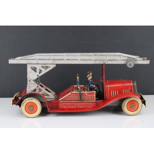 272 - Mettoy tin plate clockwork fire engine model with 3 x fireman figures, tyres marked Dunlop Fort, som... 