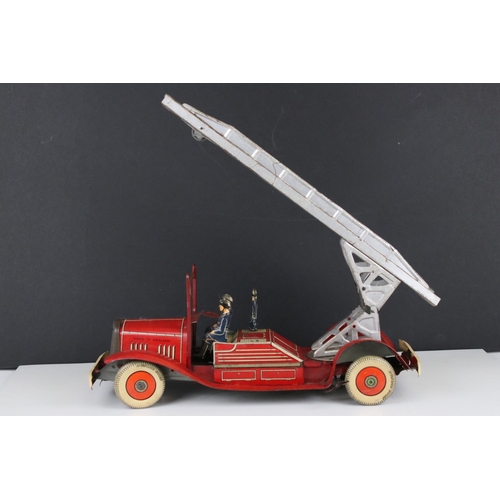 272 - Mettoy tin plate clockwork fire engine model with 3 x fireman figures, tyres marked Dunlop Fort, som... 