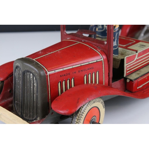 272 - Mettoy tin plate clockwork fire engine model with 3 x fireman figures, tyres marked Dunlop Fort, som... 