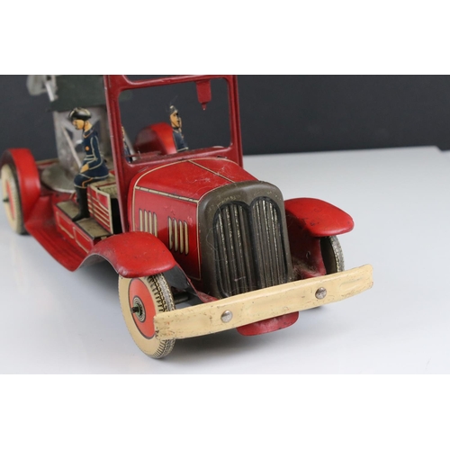 272 - Mettoy tin plate clockwork fire engine model with 3 x fireman figures, tyres marked Dunlop Fort, som... 