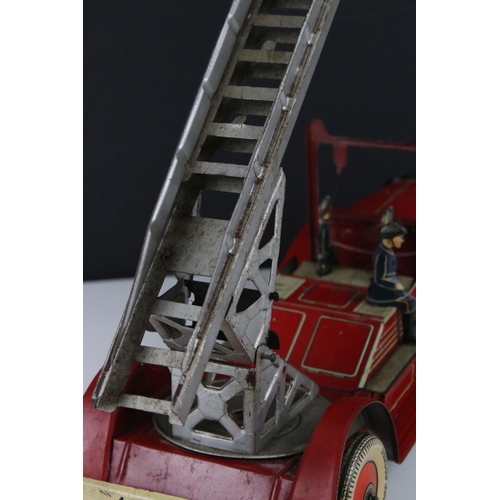 272 - Mettoy tin plate clockwork fire engine model with 3 x fireman figures, tyres marked Dunlop Fort, som... 