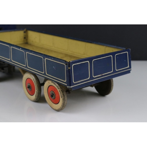 273 - Mettoy tin plate clockwork articulated lorry, the tyres marked Dunlop Fort, 42cm, some rusting, gd o... 