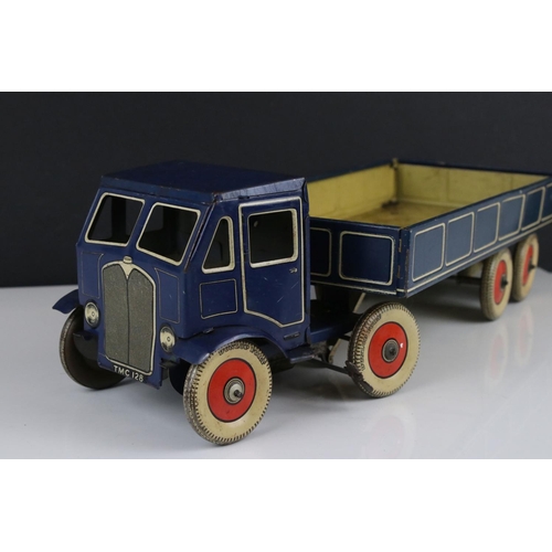 273 - Mettoy tin plate clockwork articulated lorry, the tyres marked Dunlop Fort, 42cm, some rusting, gd o... 