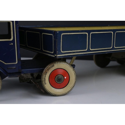 273 - Mettoy tin plate clockwork articulated lorry, the tyres marked Dunlop Fort, 42cm, some rusting, gd o... 