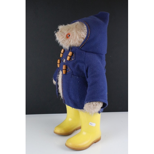 293 - A Gabrielle Paddington Bear c.1960/70's with blue coat and yellow Dunlop boots.