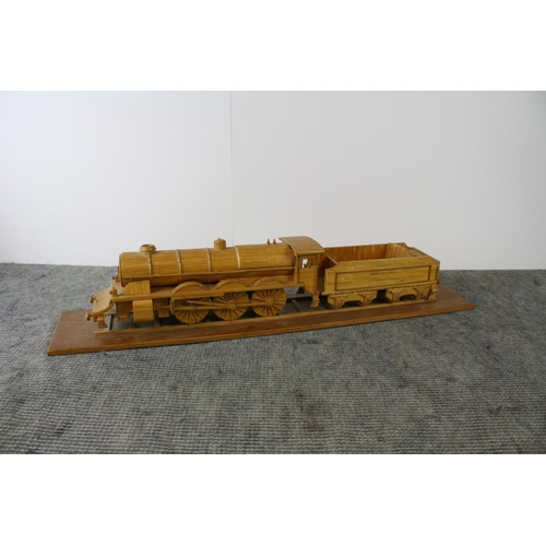 1178 - A scratch built wooden model of a steam train together with a scratch built wooden model of a paddle... 